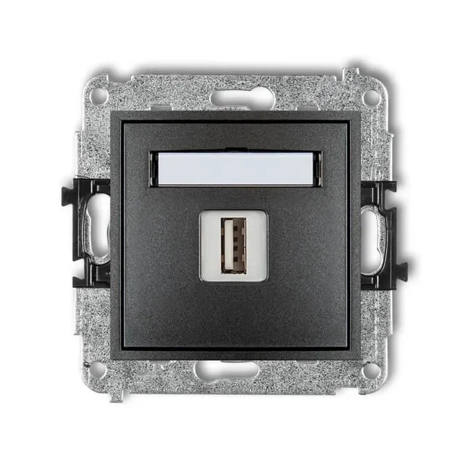 Ładowarka pojedyncza USB typu A 1A Karlik MINI w kolorze grafitowym z ramką, widoczna od frontu na białym tle.