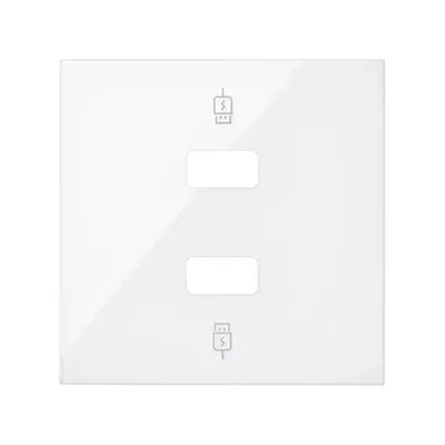 Biała, błyszcząca pokrywa ładowarki Simon 100 z dwoma otworami na gniazda USB i symbolami ładowania.