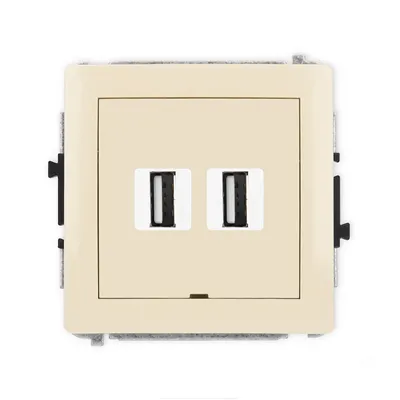 Podwójne gniazdo USB-A 2.0 Karlik DECO w kolorze beżowym, z dwoma portami USB do ładowania urządzeń.