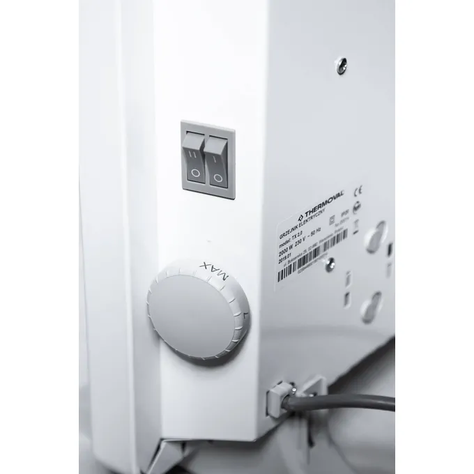 Grzejnik elektryczny Thermoval TX 2500W z pokrętłem regulacji temperatury i dwoma przełącznikami.
