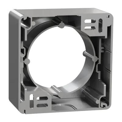 Podstawa natynkowa Schneider Sedna Design SDD113901 wykonana ze srebrnego aluminium, z widocznym otworem na mechanizm.
