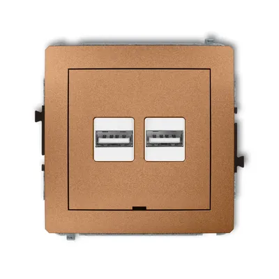 Karlik DECO podwójna ładowarka USB typu A+A w kolorze złotego metaliku z dwoma białymi gniazdami USB.