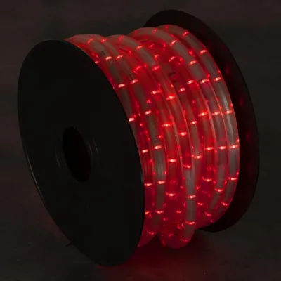 Czerwony wąż świetlny LED Kanlux GIVRO 30M na czarnej szpulce, idealny do dekoracji.